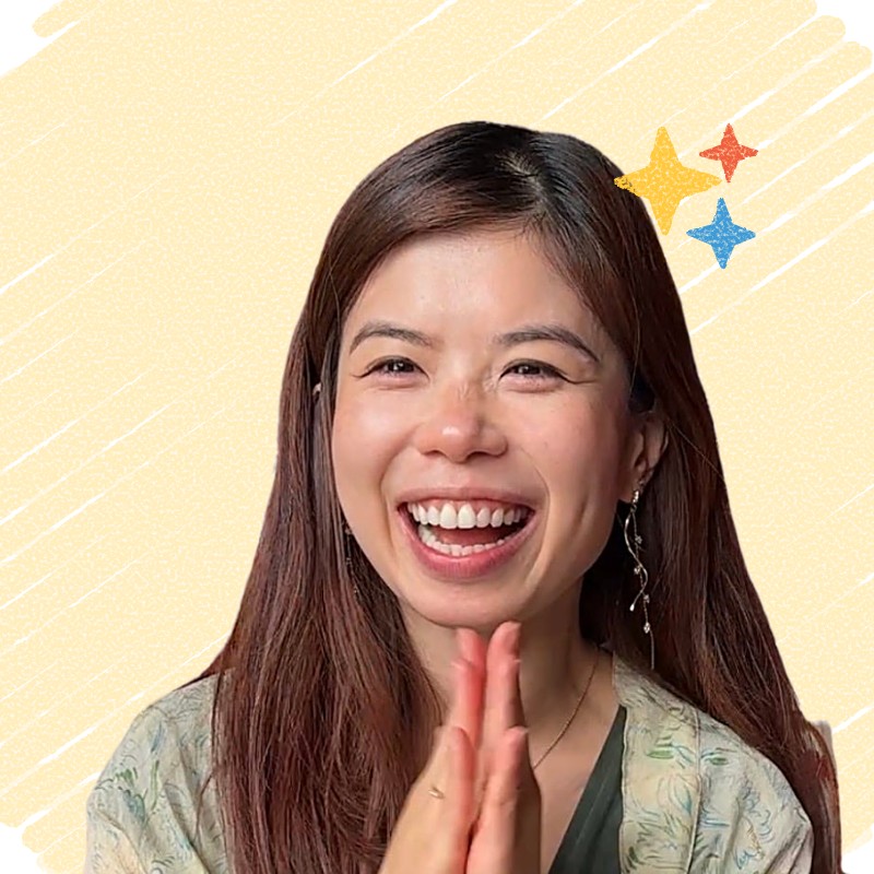 Joei Chan laughing, hands pressed together